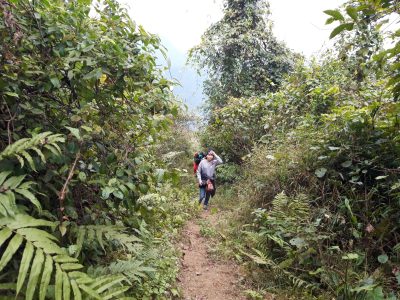 Walking forest trails between villages in Pu Luong