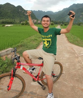 Mai Chau valley landscape with flat rice fields cycling routes and traditional stilt houses in Vietnam