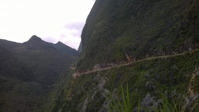 Ha Giang loop dramatic limestone mountains and winding road in northern Vietnam