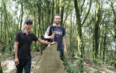 Reaching the summit of Mount Pu Luong after a challenging forest trek