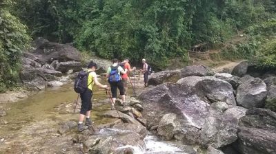 Pu Luong hiking 2 days 1 night with a local guide walking slowly through mountain trails