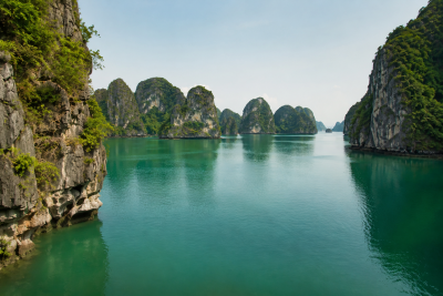 Peaceful limestone islands in Bai Tu Long Bay Vietnam
