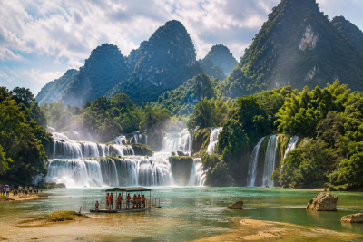 Ban Gioc waterfall surrounded by limestone mountains in Cao Bang Vietnam