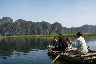 Van Long Nature Reserve boat trip with limestone mountains in Ninh Binh